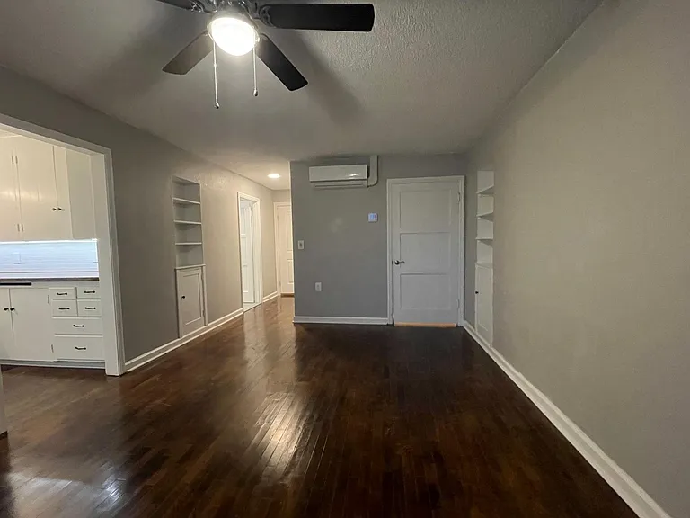 Living room - new mini splits (heating / cooling), refinished original oak floors, built in storage, and ceiling fans