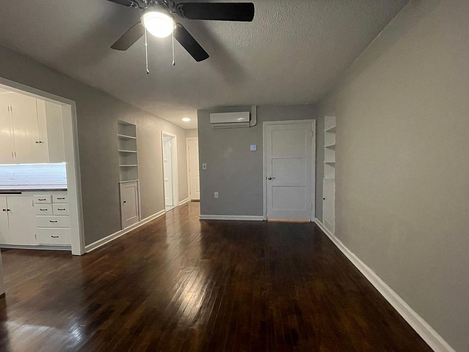 Living room - new mini splits (heating / cooling), refinished original oak floors, built in storage, and ceiling fans