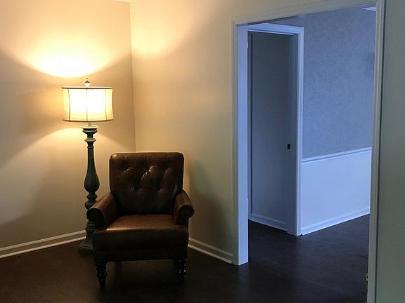 Living Room looking into Dining Area w/ Hallway to Bedrooms