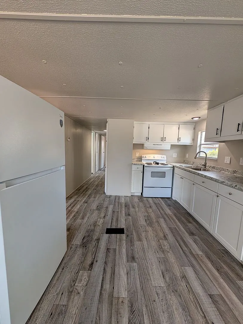 Beautifully renovated 3 bedroom, 1.5 bath home on a spacious .65-acre lot with a fenced backyard ... — Photo 3