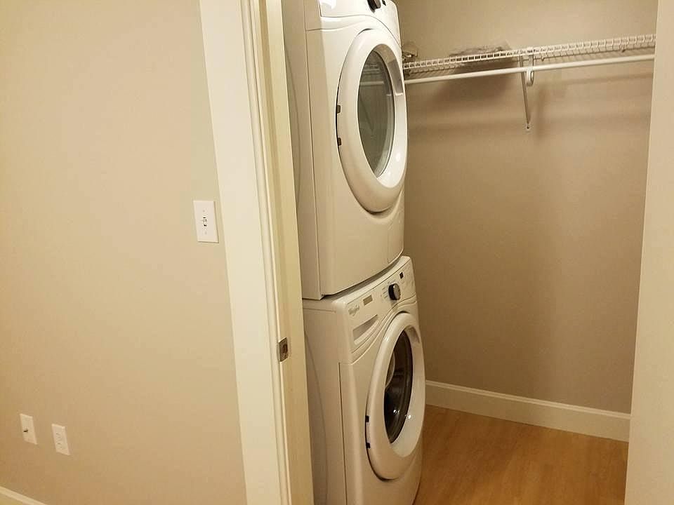 Brand new stackable washer/dryer in bedroom closet