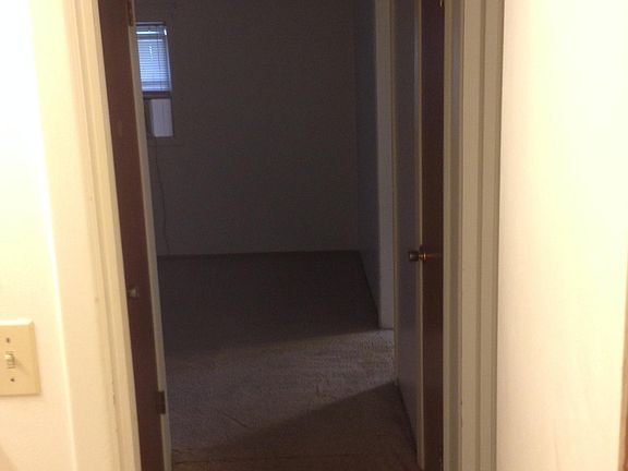 hallway out of bathroom into living room