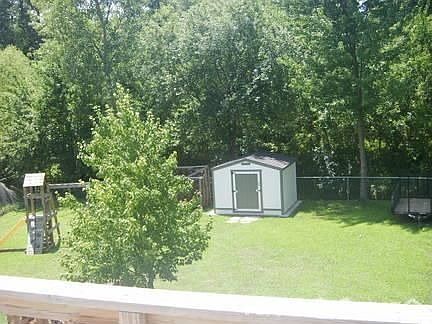 Back yard
						:
						Creek just behind shed. 20 arc of woods