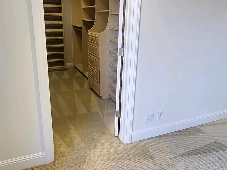 Entrance into large primary bedroom walk in closet.