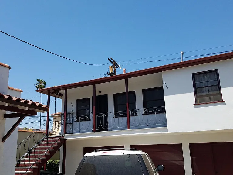 Outside view of apartment which is located to the left