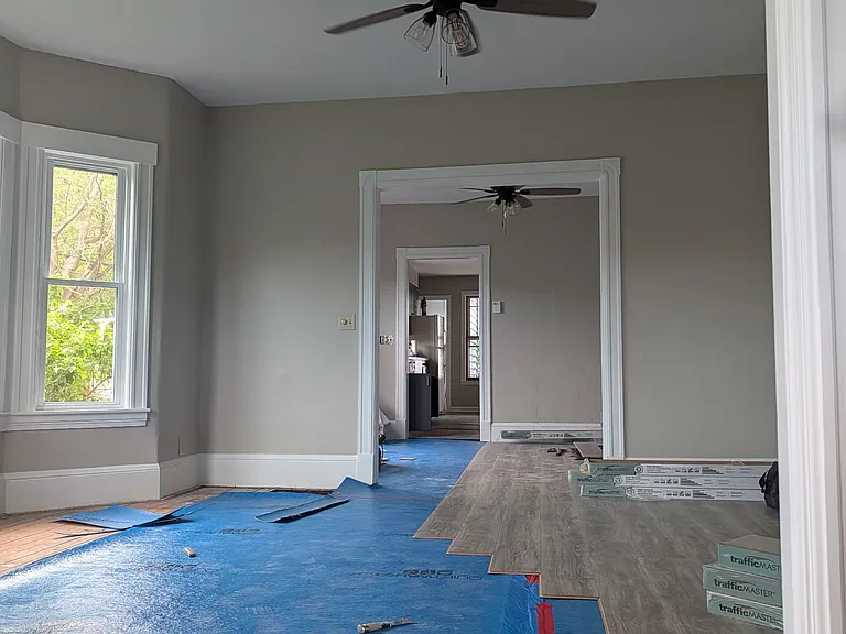 Living, dining, and kitchen with a half bathroom on the first floor.