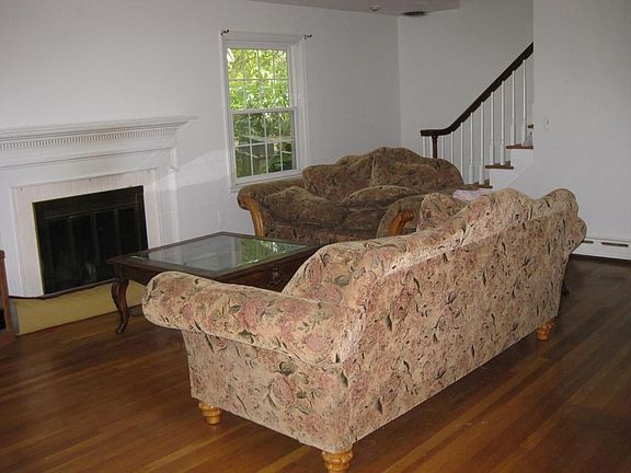 Large living rm w/ FP & wood fl