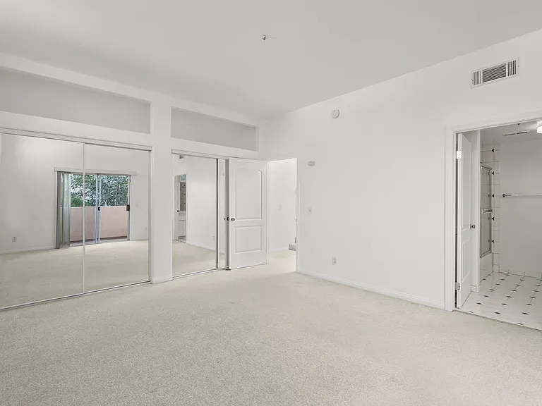 Two closets and bathroom in master bedroom.