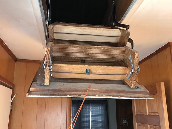 Pull down stairway to great floored storage area in the attic. This is above the entrance foyer.