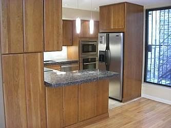 Kitchen next to dining room (new refrigerator not pictured)