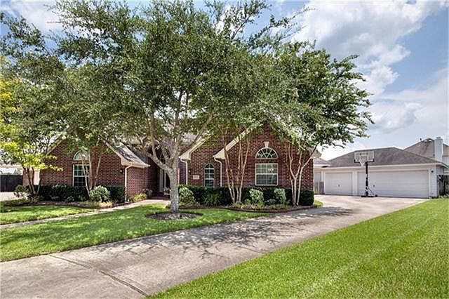 The home features a three car garage with a small air conditioned space for pets or storage.
