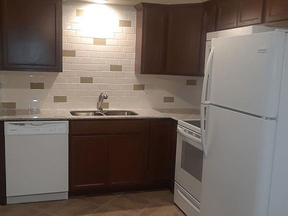 kitchen with all new appliances and granite counters