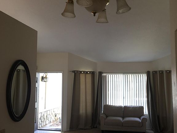 Front room with Large windows and fireplace