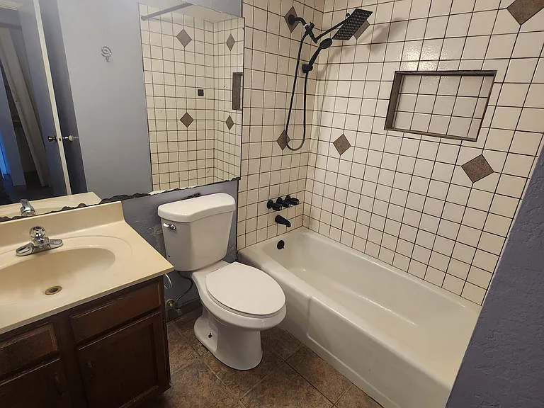 hallway bathroom with tub