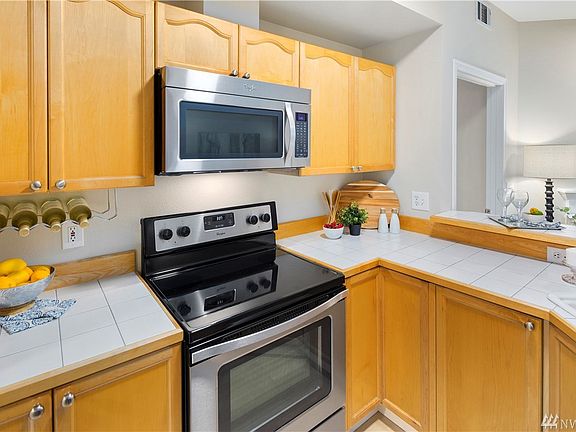 Display your favorite libation in the under mount bottle rack, and large pots and pans in the deep base cabinets, including a revolving "lazy susan" corner cabinet.
