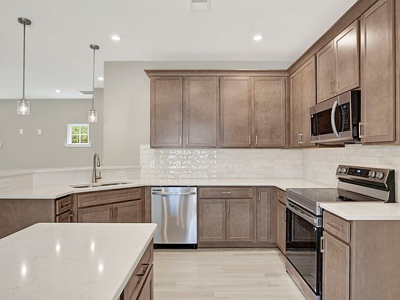 Aspen Plan Kitchen with Raised Bar and Island - Open Concept