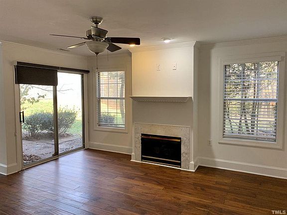 Living area with adjacent patio (fireplace is non-working)
