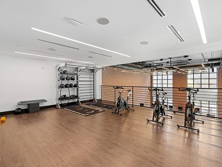Recharge in this airy mezzanine studio_perfect for spin sessions, circuit training, or solo workouts.
