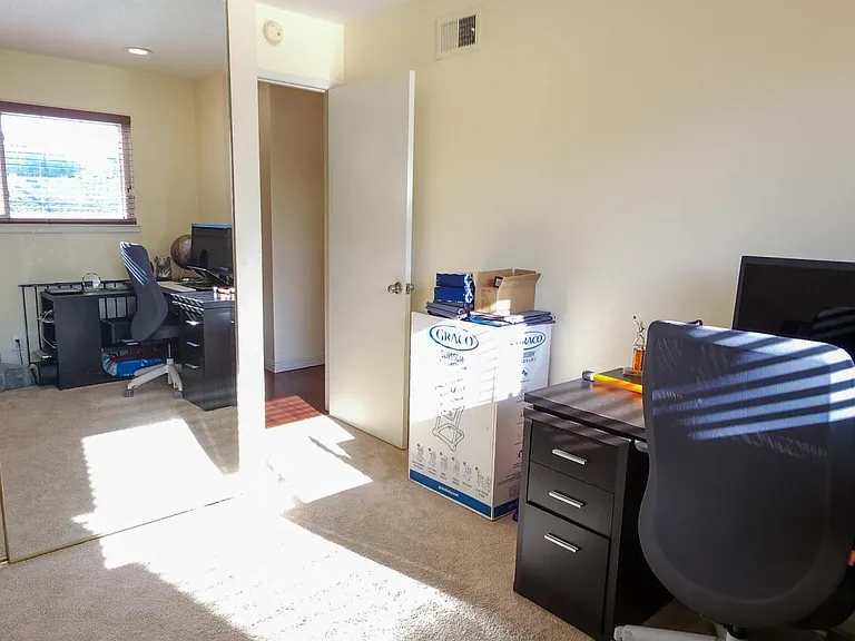 Office room/ bedroom 4 with carpets before which have now been replaced with wooden flooring