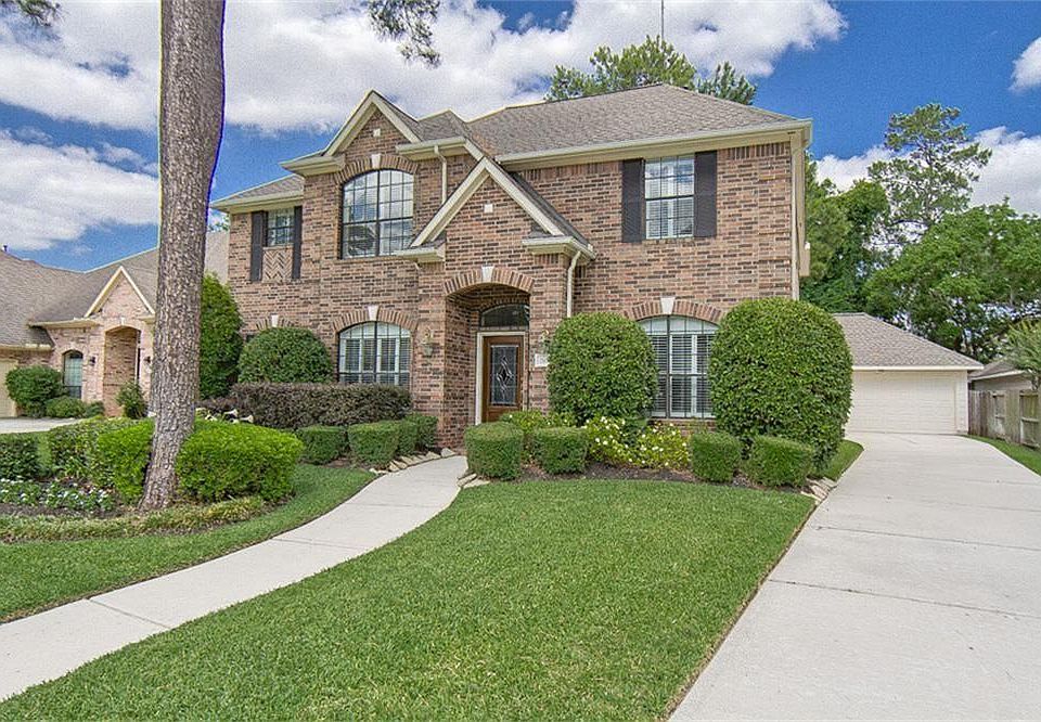 Right front view with lush landscaping