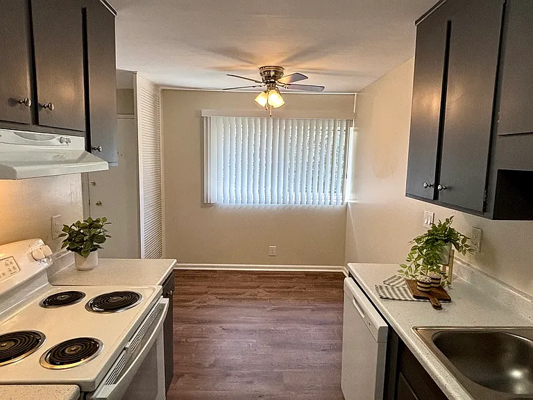 Unit 211B:
View of bright dining area from kitchen