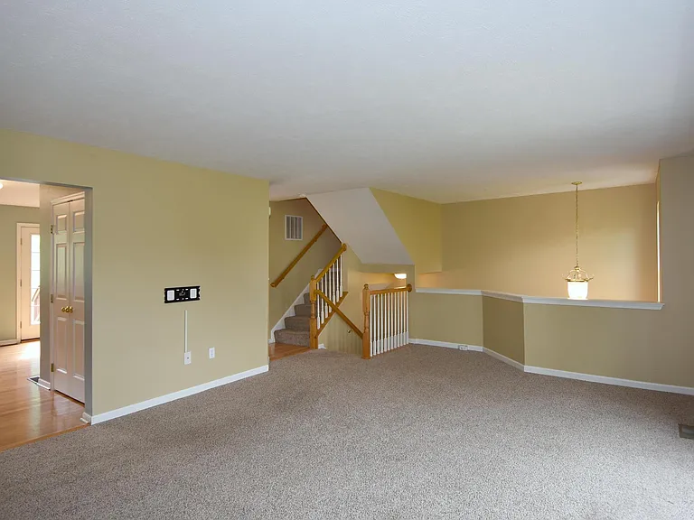 The kitchen is accessible from both the sides of the living room.
