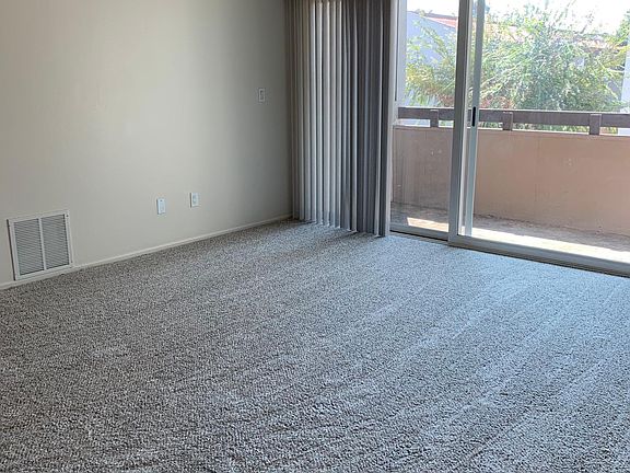 Large open living space and patio doors to private balcony