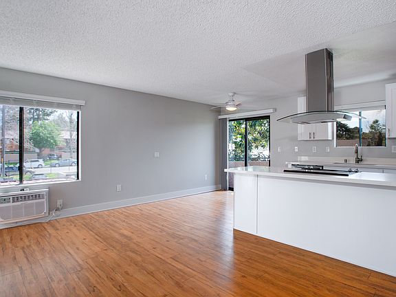 Dining room and living room are adjacent to the kitchen