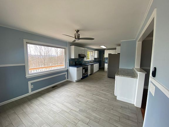 Ceiling fan with light in Kitchen