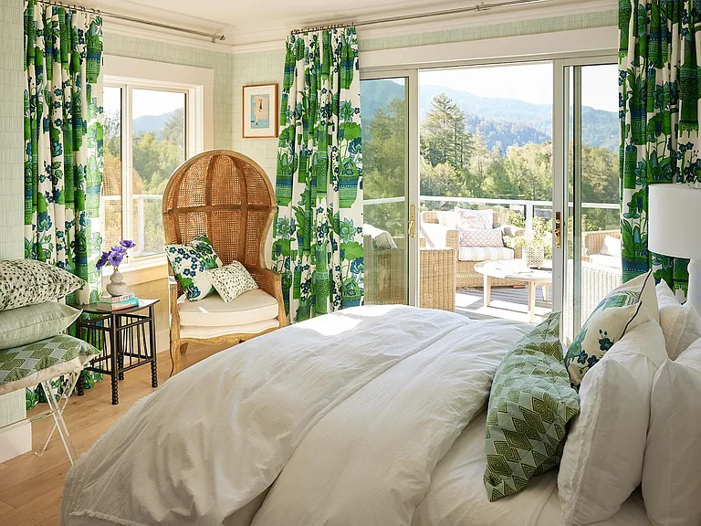 'Green Bedroom' - Queen size bedroom off of enclosed hallway. This view-facing bedroom has sliding patio doors to the deck. Nice sized closet with hang bar and shelf.