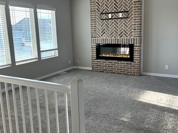 Living room- custom fireplace with upgraded fireplace with remote, flame color changing