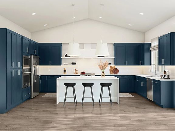 Kitchen with vaulted ceilings and pendant lighting