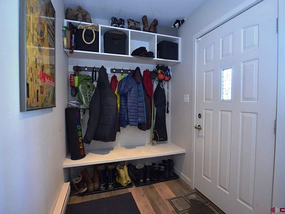 Built in seating and cubby storage with coat rack.