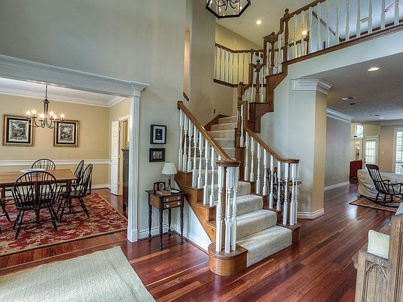 Grand 2 story entry with beautiful Brazilian Cherry hardwood floors though-out first floor.