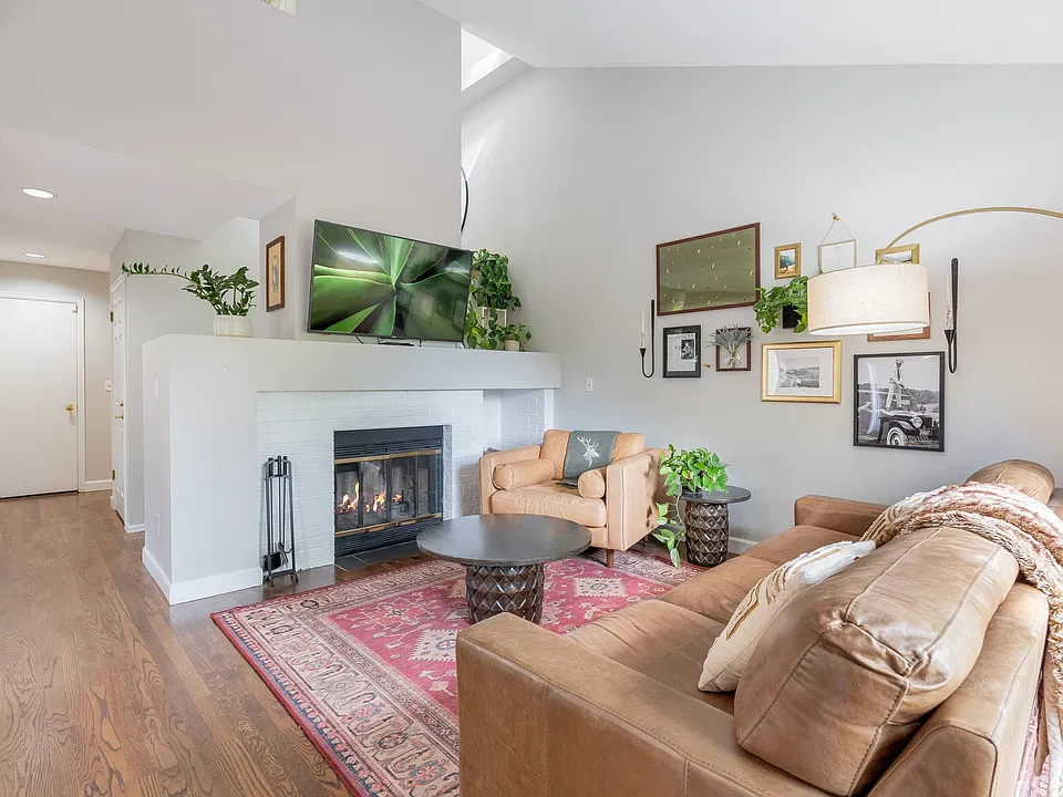 Living room with wood burning fireplace