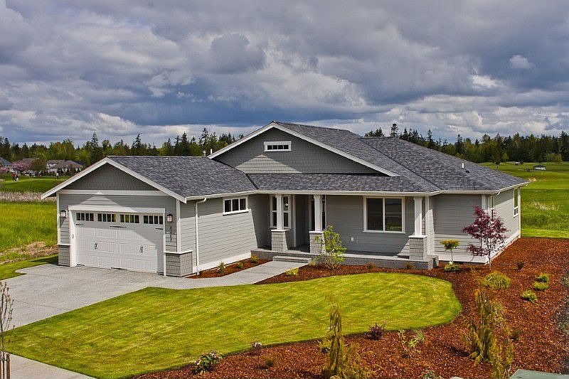 Adorable exterior with fresh, clean landscaping and a fantastic golf course view!