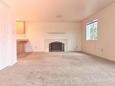 Living room. The kitchen is to the back and left