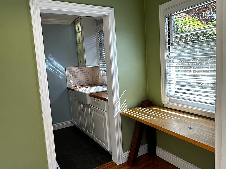 Dining nook/office leading to kitchen.