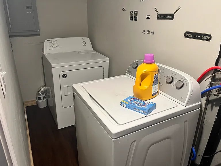 Private laundry room with washer and dryer provided