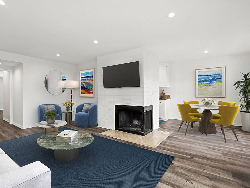 Open-Concept Dining and Living Room with Fireplace