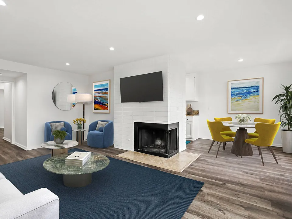 Open-Concept Dining and Living Room with Fireplace