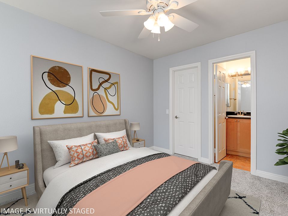 Primary bedroom with large closet and private bathroom access.