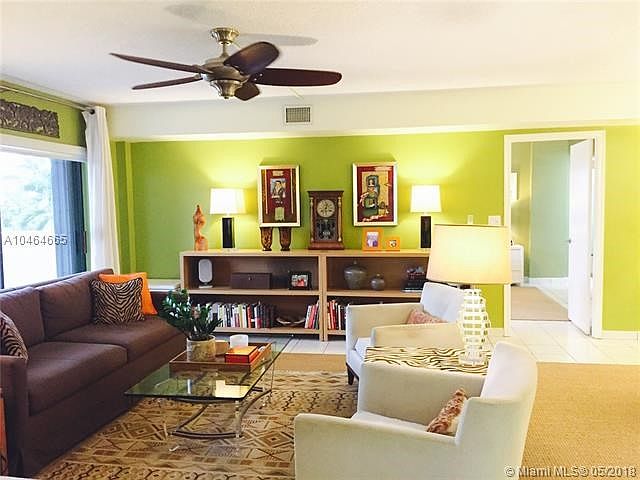 This well maintained spacious condo has a large open floor plan with split bedrooms for maximum privacy, floors are all tiled, n