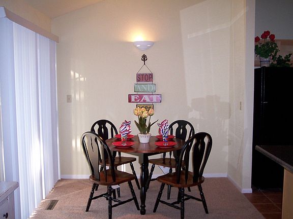 Vaulted dining area with walk out to the patio.