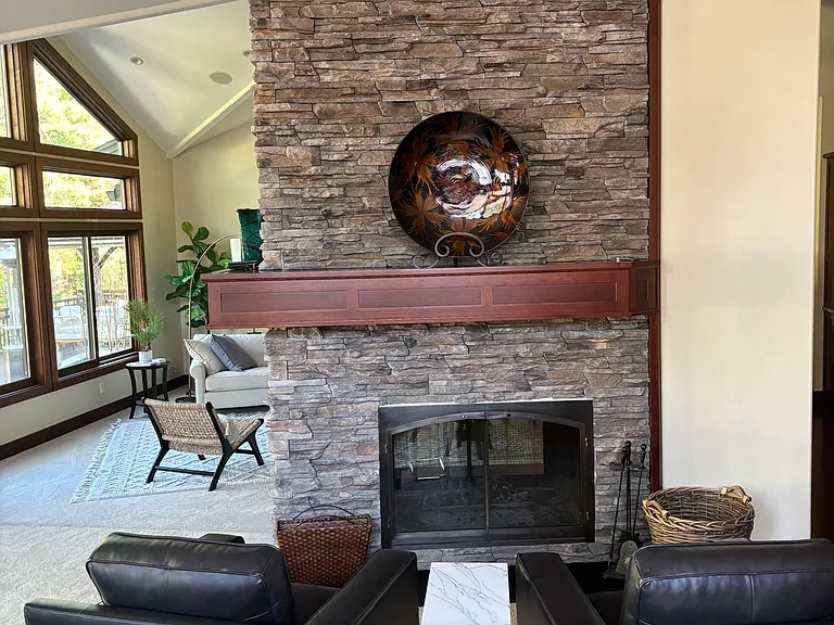 Relax in front of the fireplace in cozy club chairs.