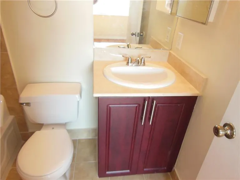 Updated second floor private shower/bath combination.