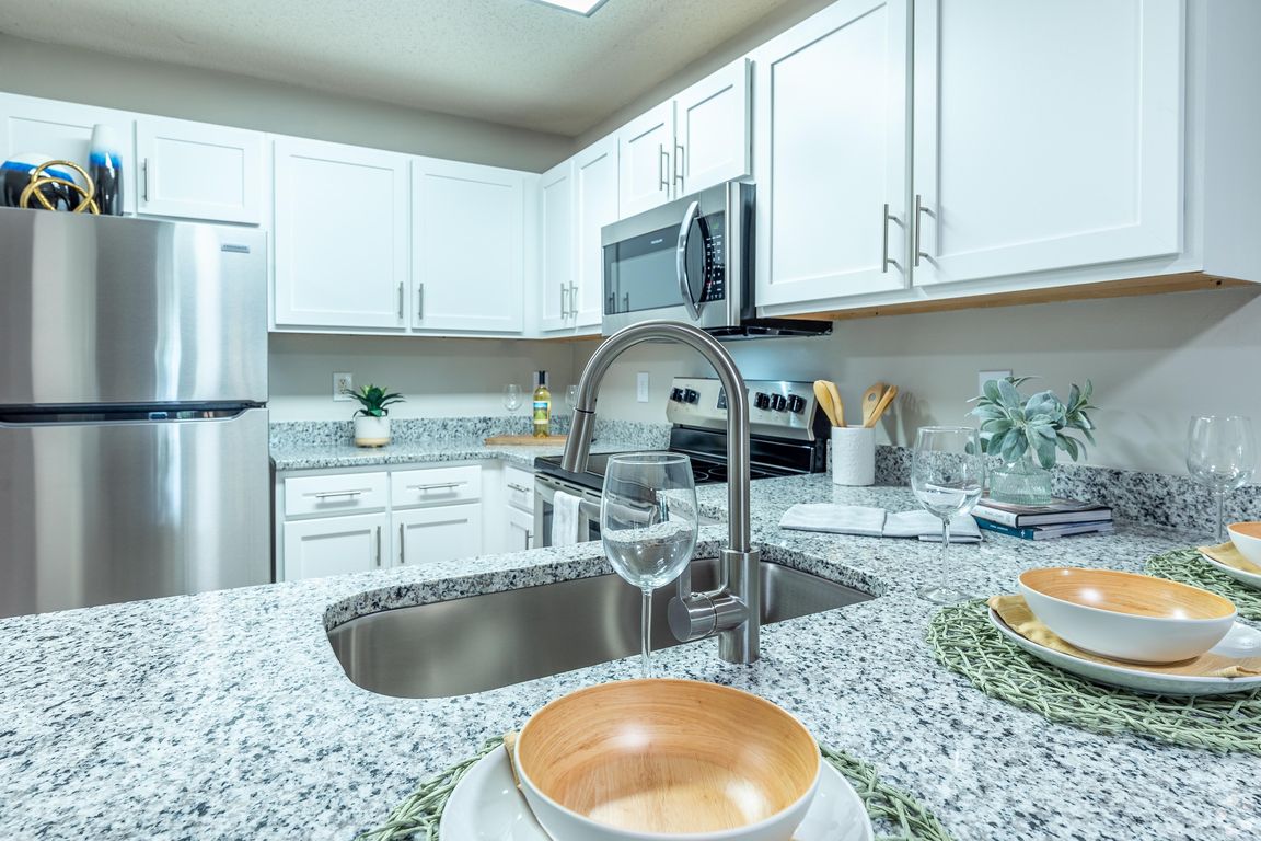 Kitchen with granite counters and stainless appliances