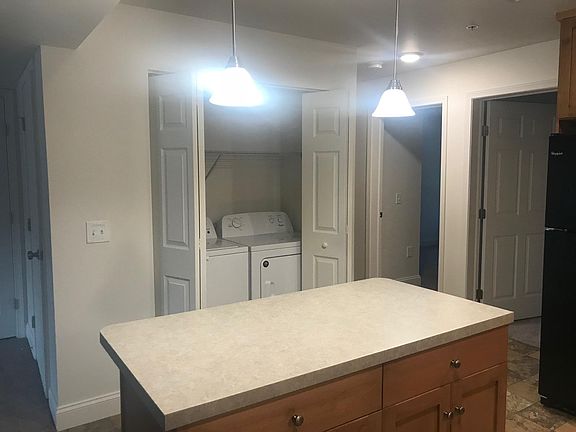 Kitchen Island, Washer/Dryer Closet (Please Note: The featured photos are of a similar unit.)