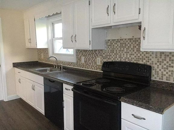 Clean and pristine kitchen area with newly installed appliances