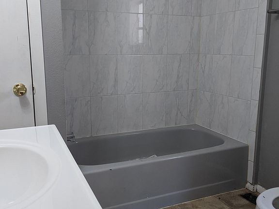 Just finishing putting in new vanity. Updated shower enclosure.